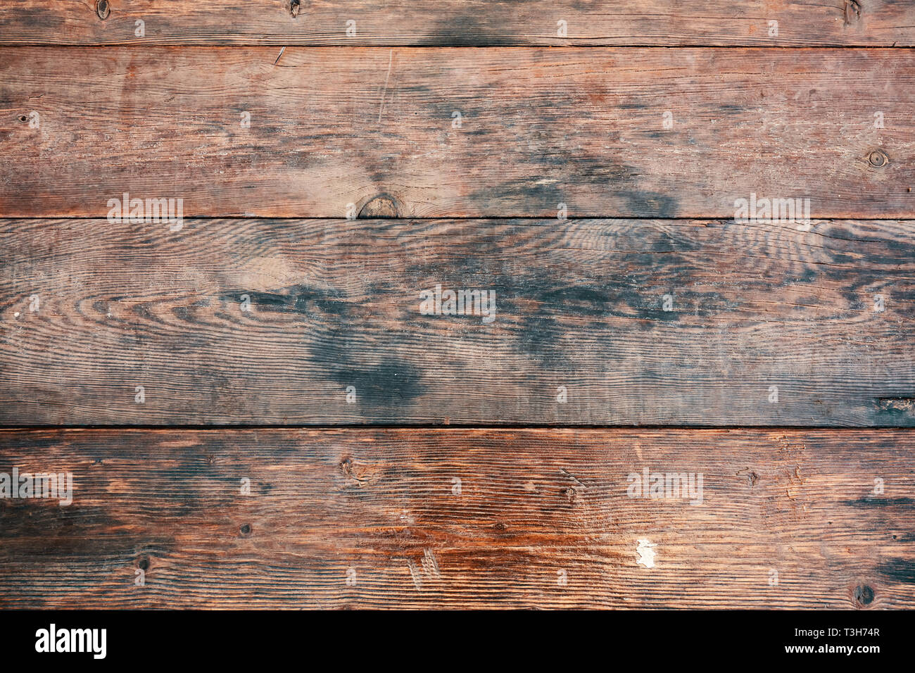 Marrone scuro dello sfondo in legno a luce naturale Foto Stock