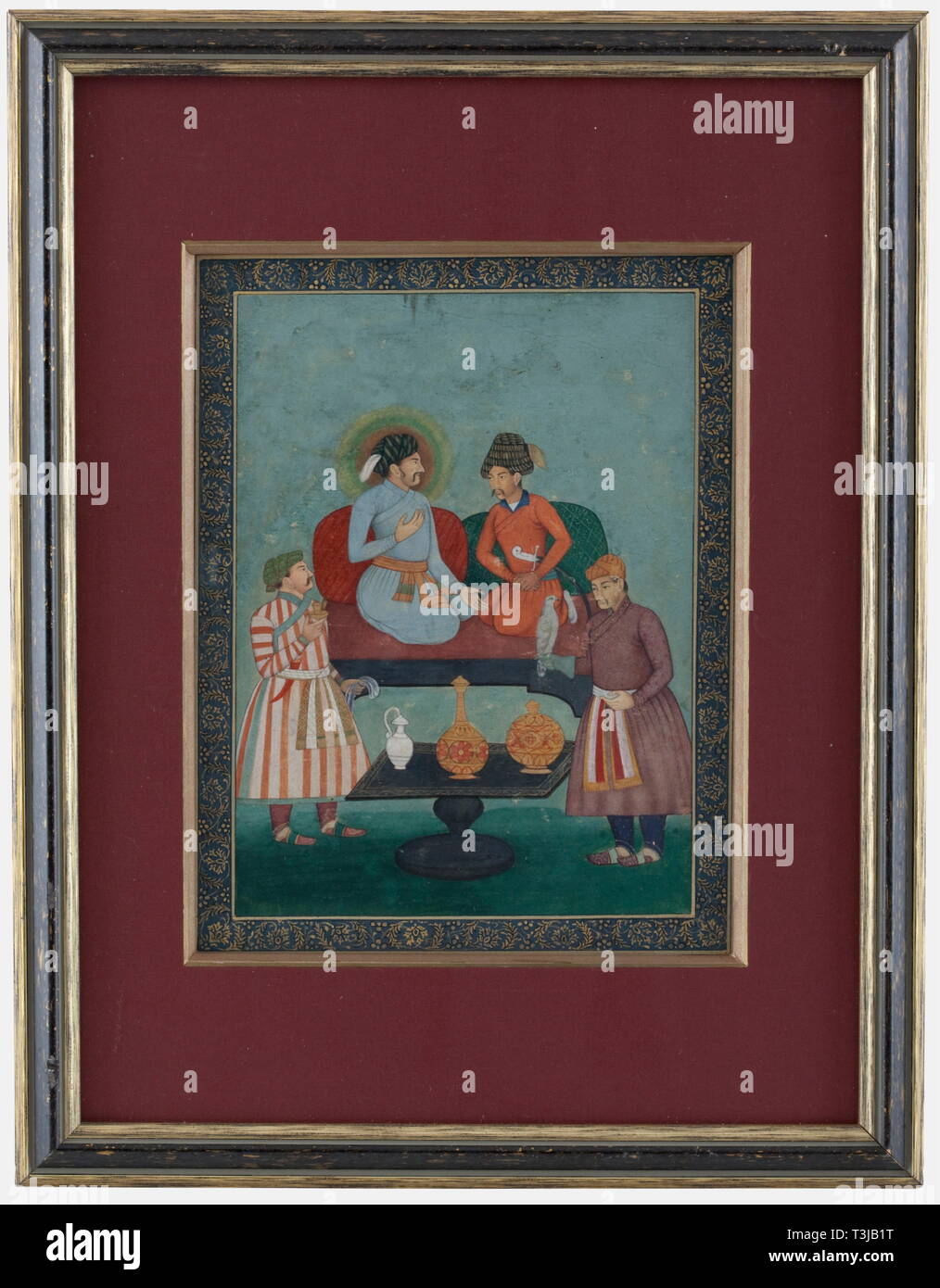A nord del magnate indiano miniatura, probabilmente di Mewar, secolo XIX gouache su carta. Rana Sirdar Singh, sovrano di Mewar (1838 - 42) e due principi seduto su un divano. Sulla destra un servo con un falco sulla sua mano. Oro floreali confine. In un montaggio e incorniciati, dietro il vetro. Incorniciato dimensioni 34,5 x 44,5 cm. Cfr. Shrider Andhara, cronologia di Mewar dipinti, Delhi 1987, pagina 136. storica, storica del XIX secolo, pittura, dipinti, belle arti, arte, illustrazione, oggetto, gli oggetti alambicchi, clipping, clippings, tagliate, cut-out, ritagli Additional-Rights-Clearance-Info-Not-Available Foto Stock