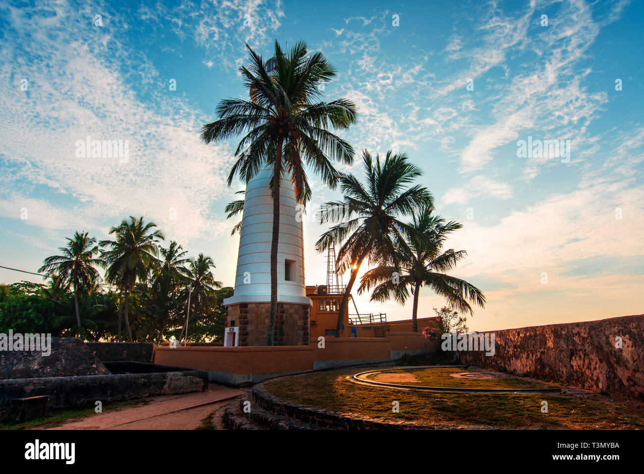 Galle Fort olandese faro e alberi di noce di cocco in Sri Lanka Foto Stock