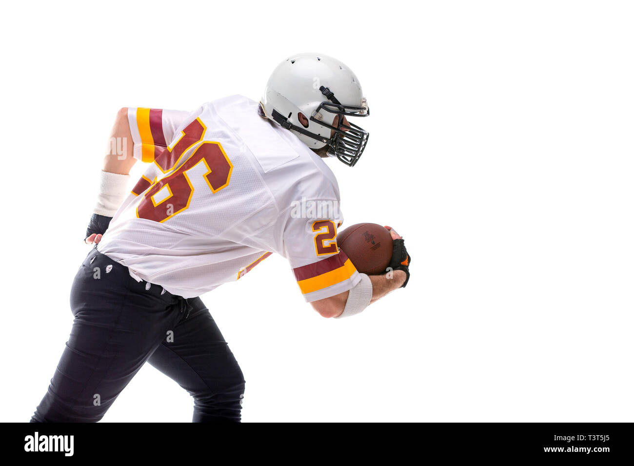 Barbuto giocatore di football americano in ation. Foto Stock