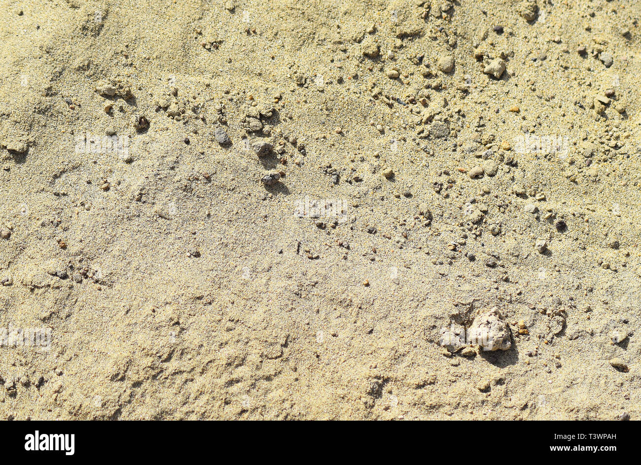 Sullo sfondo di un edificio sabbia. Materiali di costruzione. La consistenza della sabbia. Foto Stock