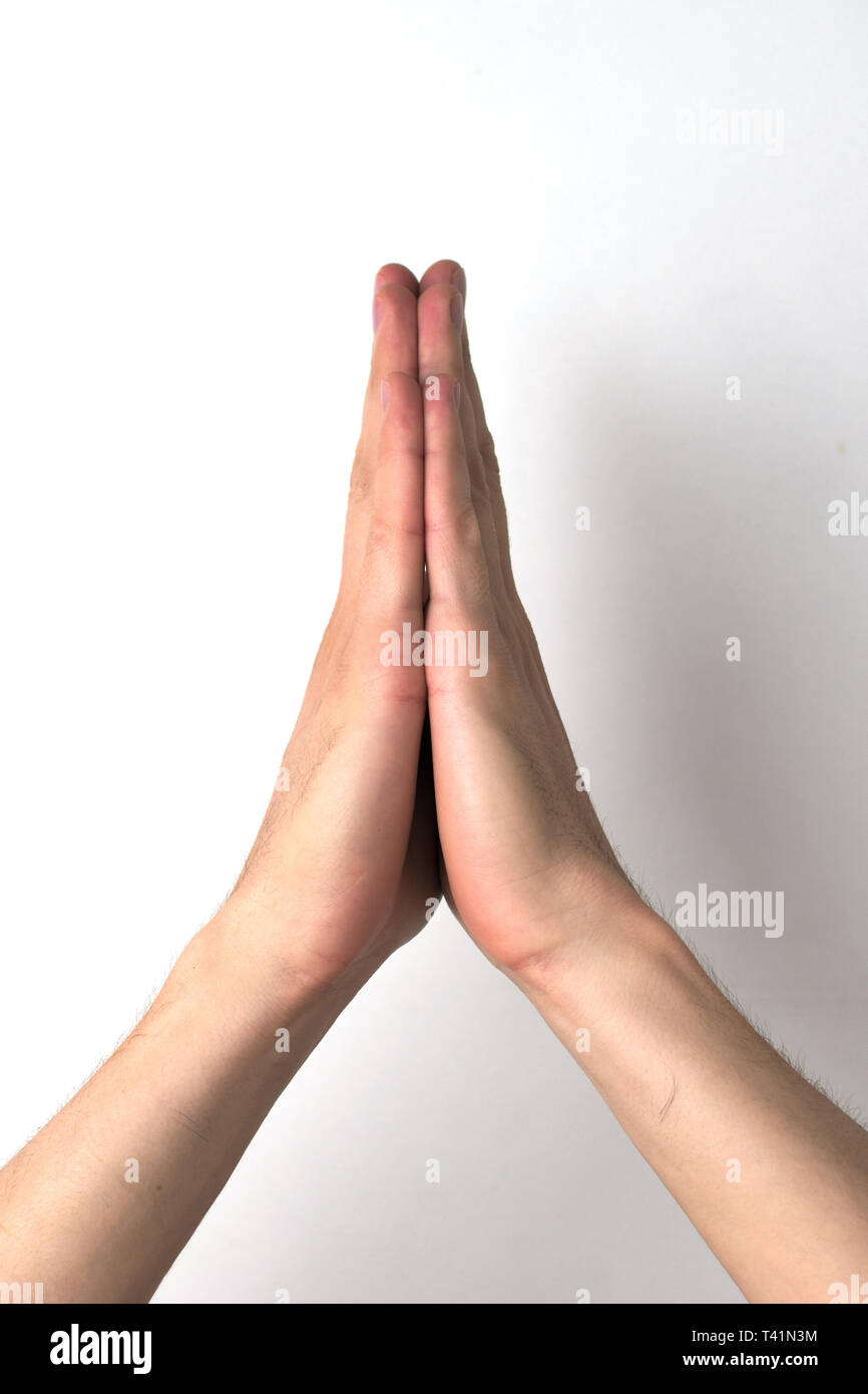 Due mani palme di giunzione, come se pregare o implorando. Foto Stock