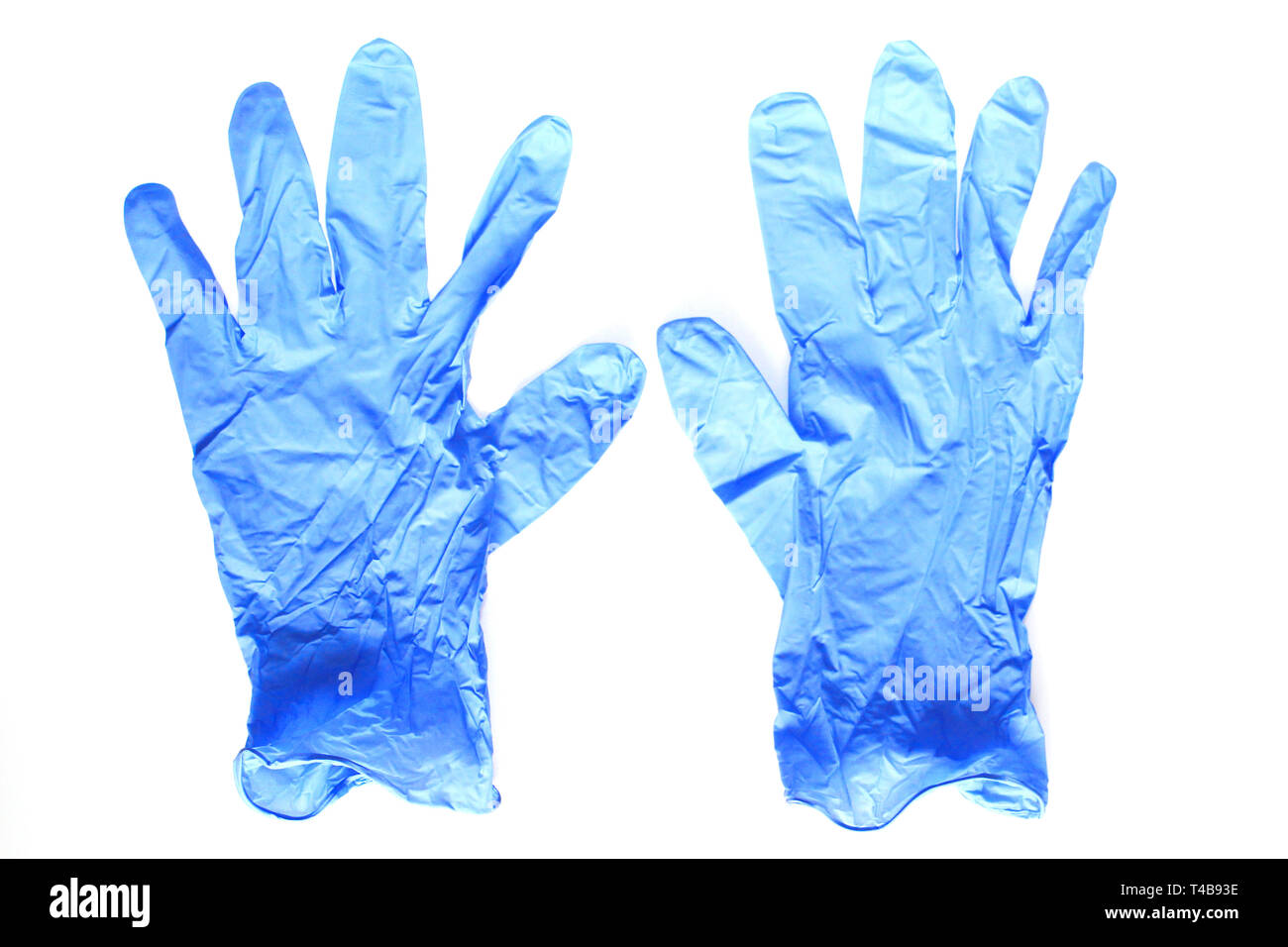 Blue guanti medicali. Lattice guanti sterili giacciono su uno sfondo bianco. Non ci sono persone. Foto Stock