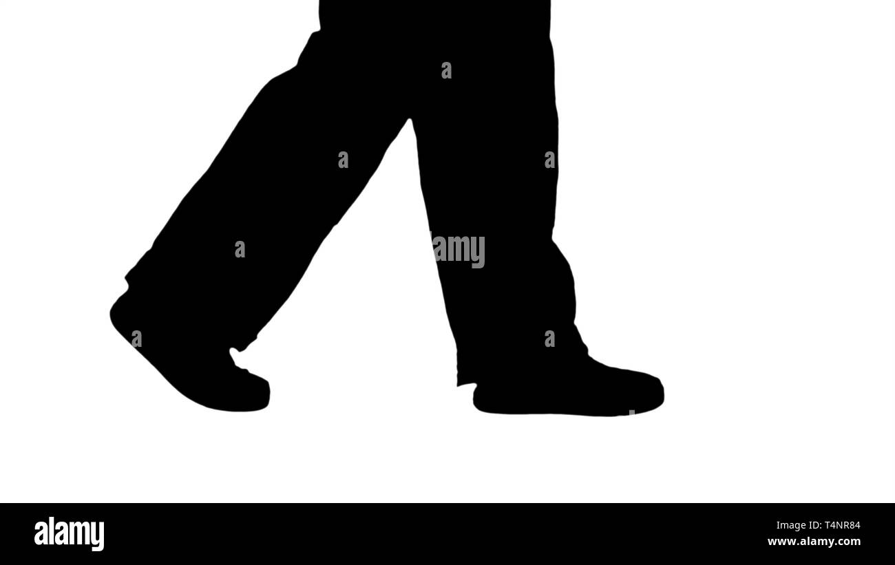 Close up sulle gambe. Vista laterale. Gambe di Silhouette di donna lavoratore edile a piedi. Professional shot in risoluzione 4K. 006. È possibile utilizzare ad esempio in voi Foto Stock