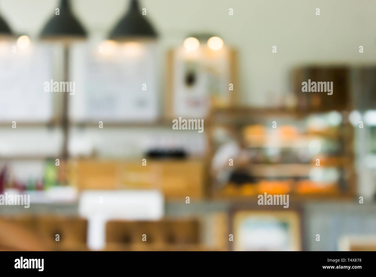 Cafe la sfocatura dello sfondo bokeh di fondo con luce. Ristorante abstract blur. Foto Stock