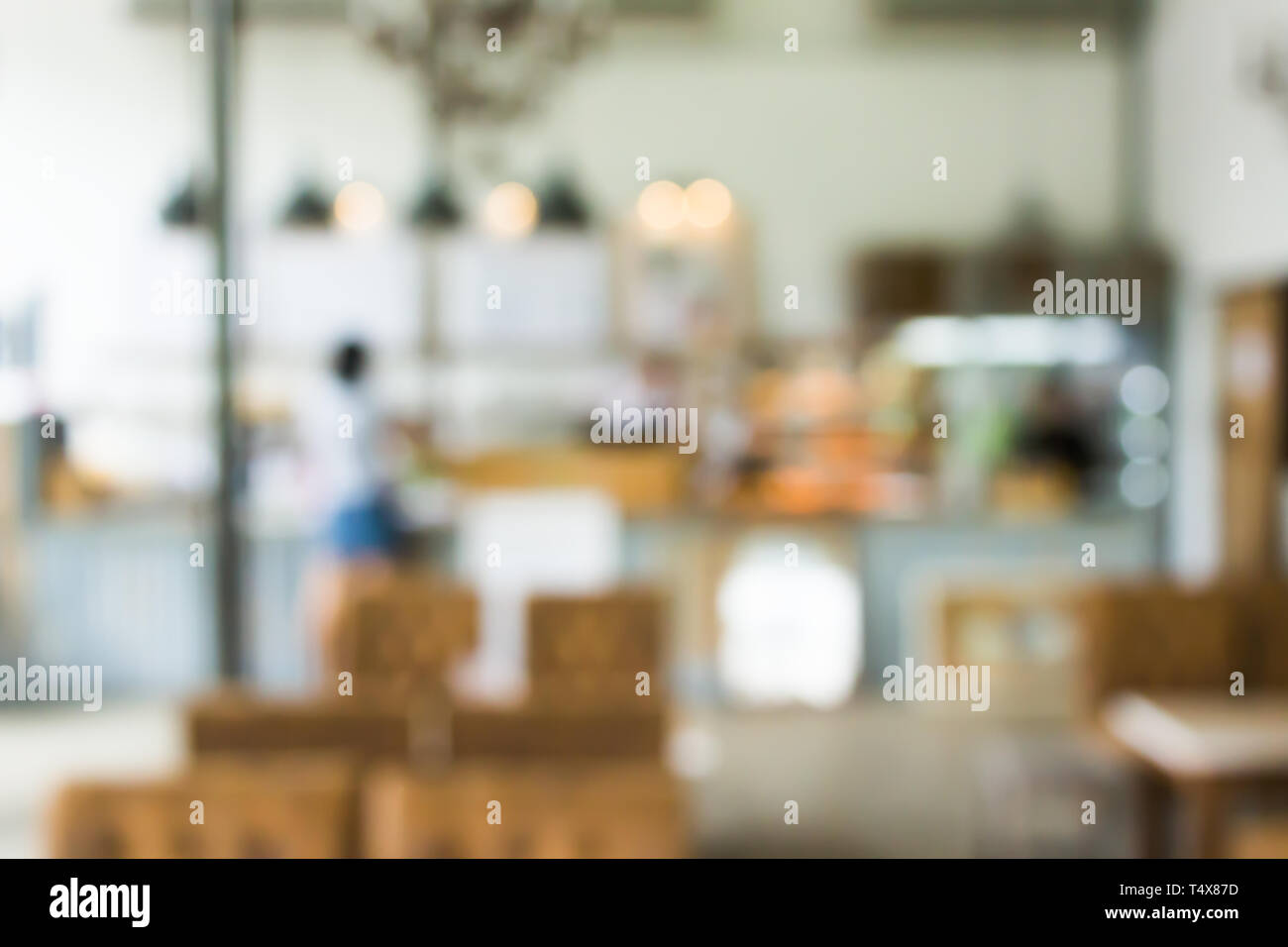 Cafe la sfocatura dello sfondo bokeh di fondo con luce. Ristorante abstract blur. Foto Stock