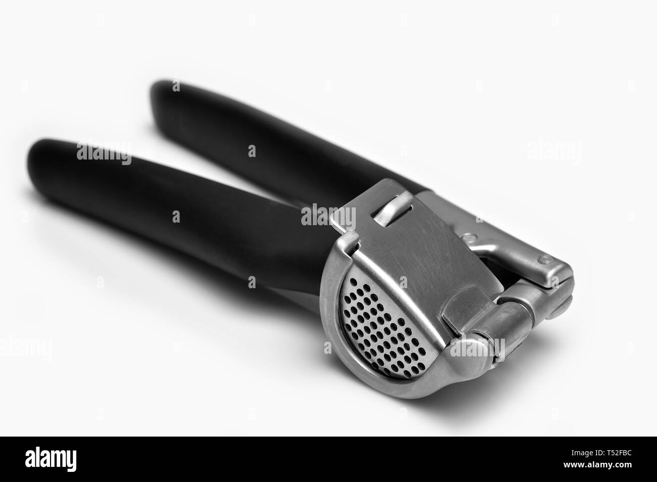 Aglio premere isolati su sfondo bianco Foto Stock