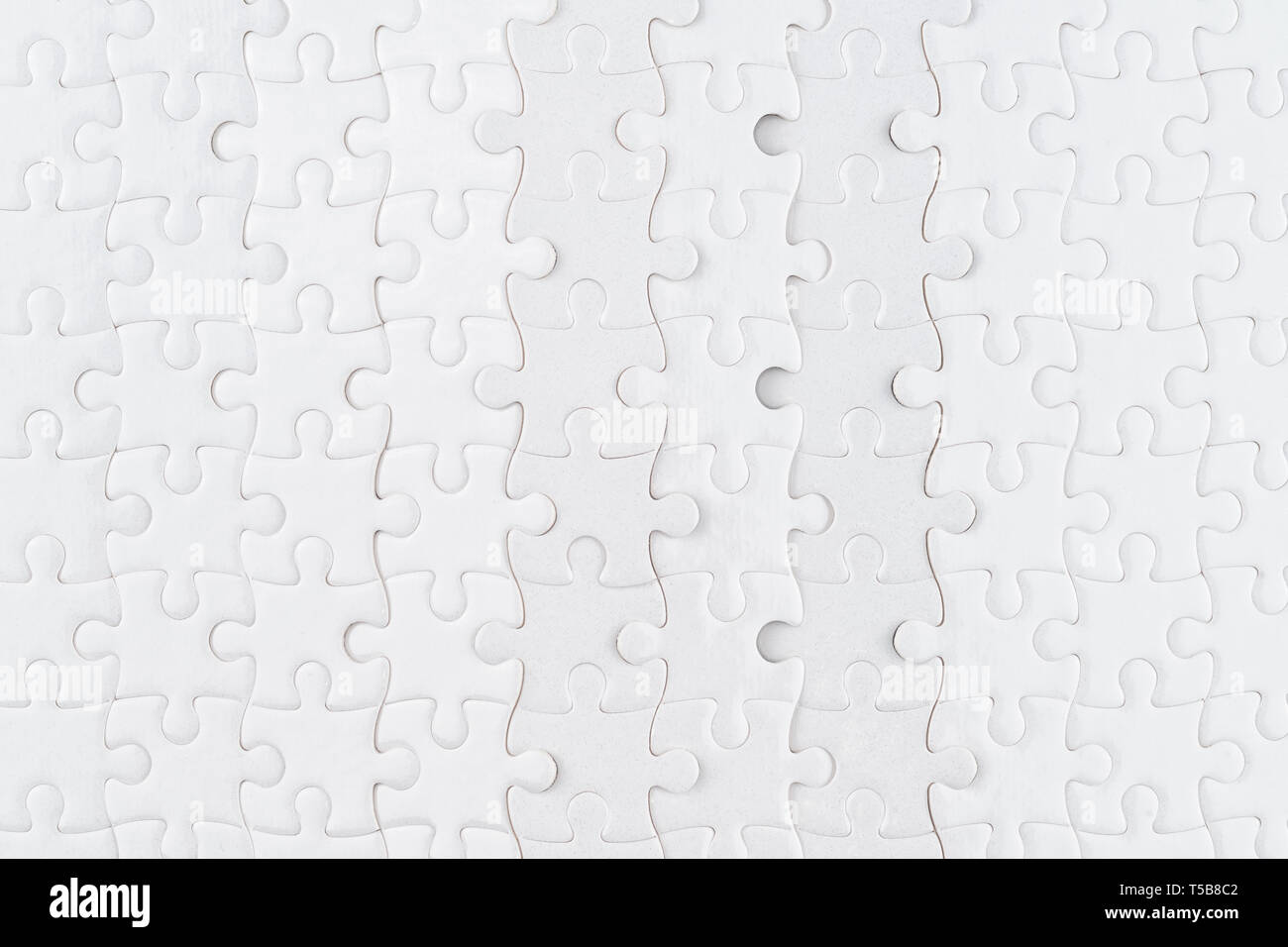White jigsaw puzzle close up. Background e texture Foto Stock