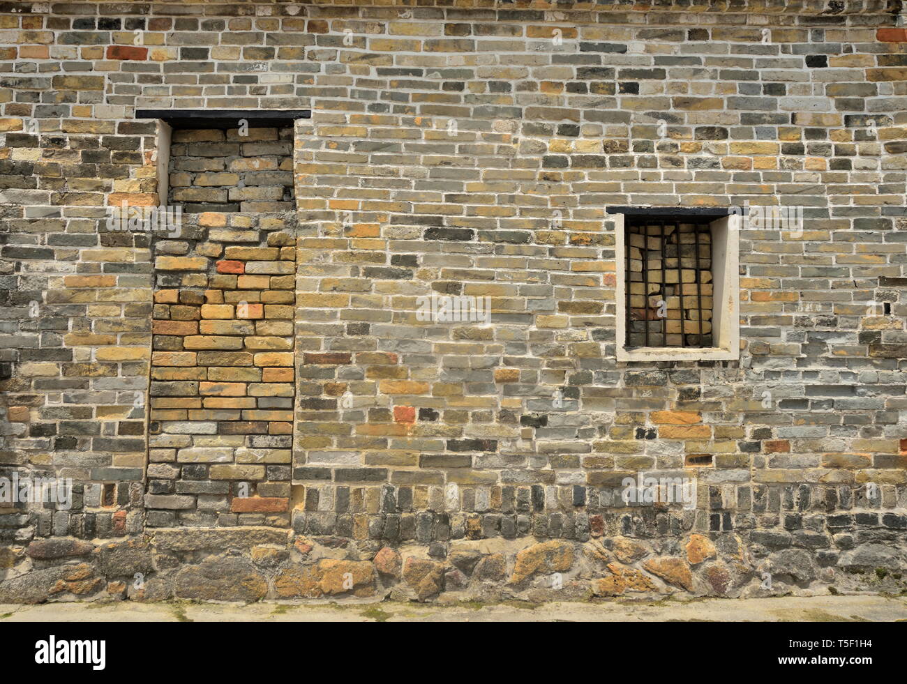 Di età compresa tra un muro di mattoni, Ping Shan, Hong Kong Foto Stock