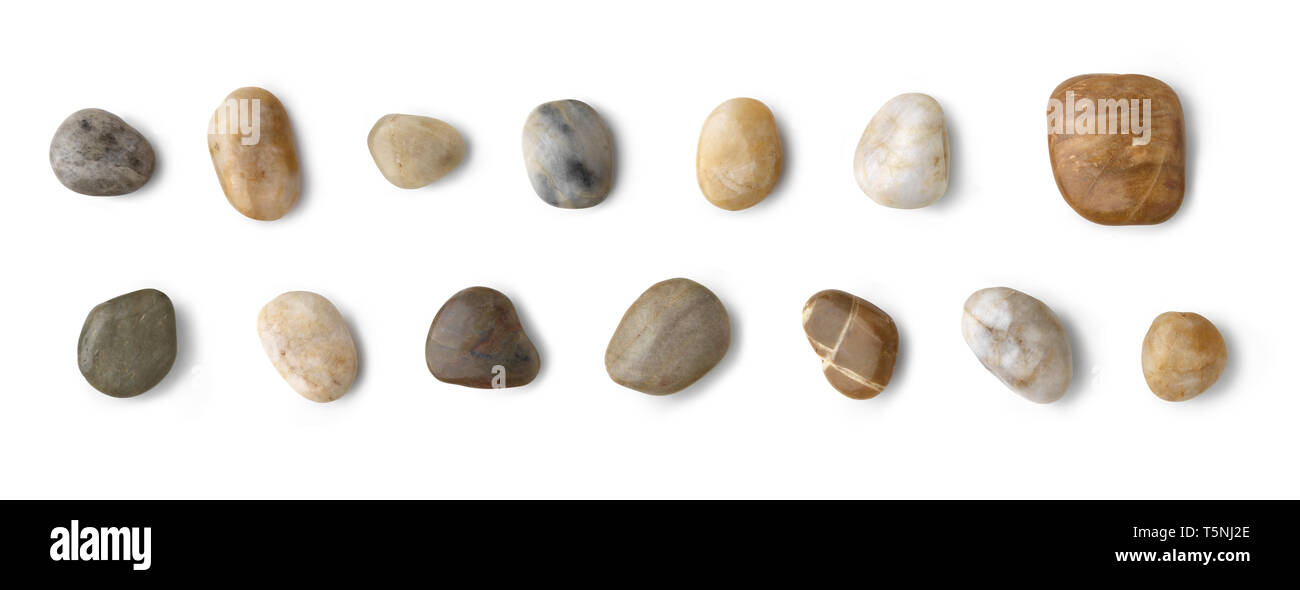 Collezione di pietre. Diversi tipi di ciottoli pietre con una morbida ombra contro uno sfondo bianco. Foto Stock