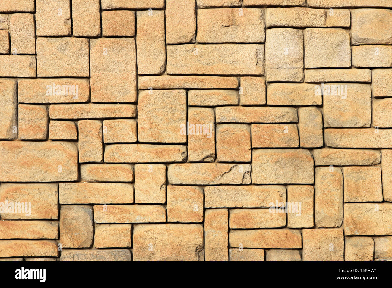 La muratura di pietra della parete di mantello texture. Forme geometriche di sfondo di superficie. Foto Stock