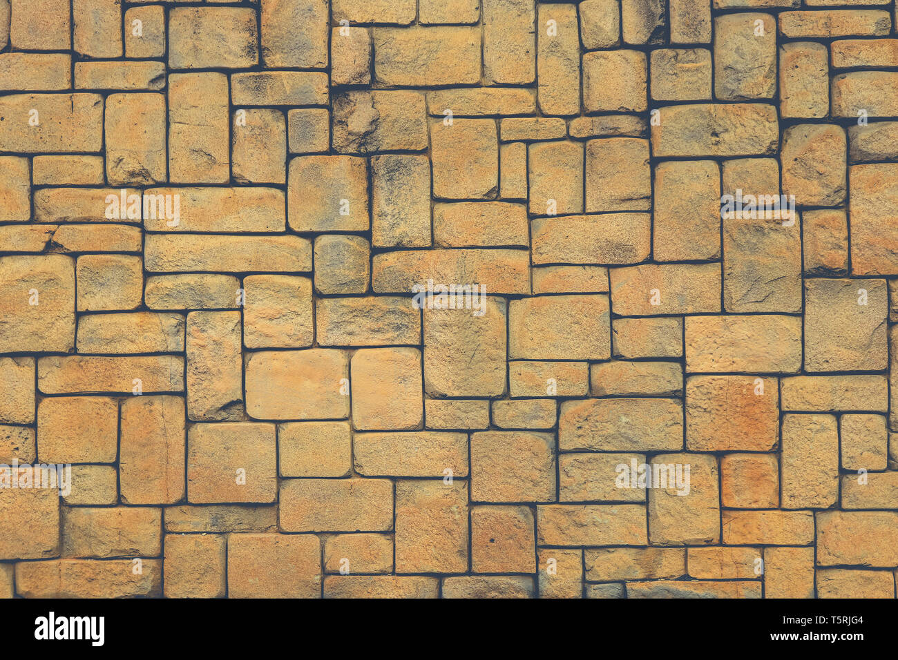 La muratura di pietra della parete di mantello texture. Forme geometriche di sfondo di superficie. Foto Stock