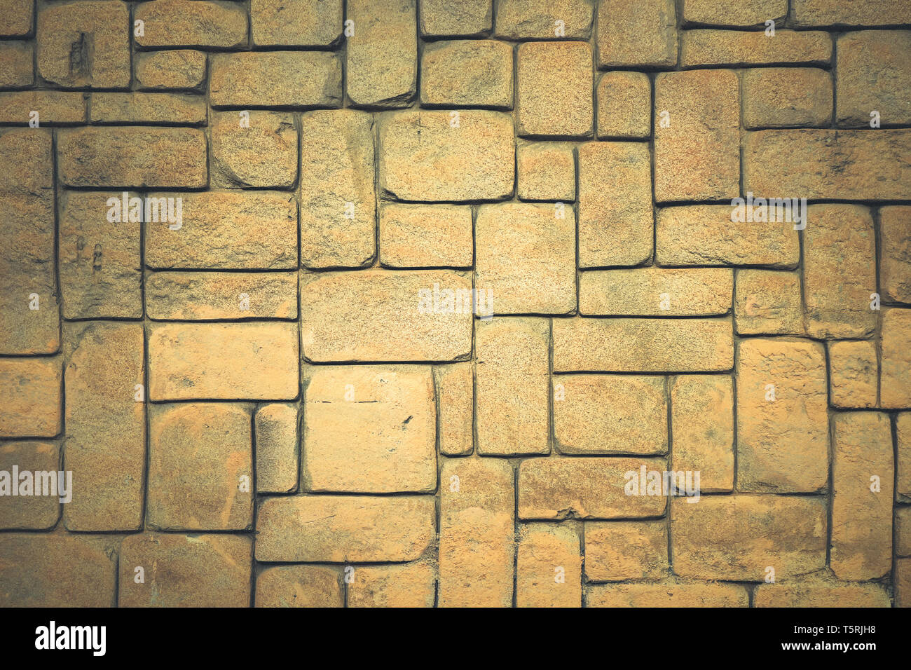 Forme geometriche di sfondo di superficie. La muratura di pietra della parete di mantello texture. Foto Stock