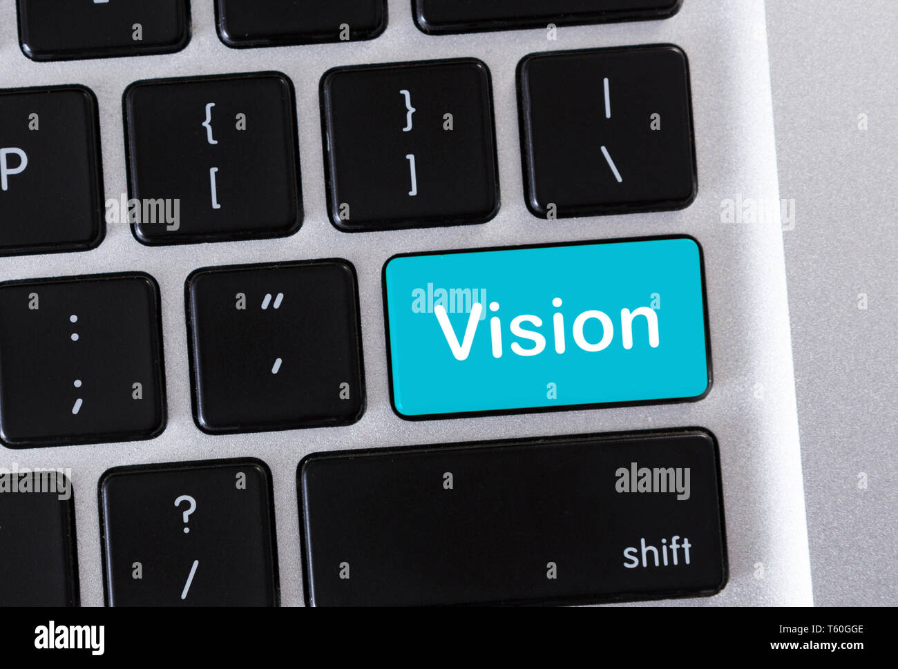 Tastiera portatile con visione del testo sul pulsante blu Foto Stock