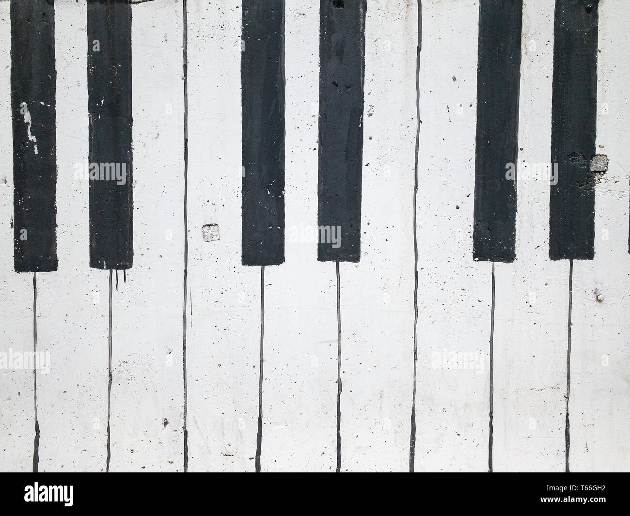 Musica per pianoforte di sfondo chiave in un muro di mattoni. Foto Stock