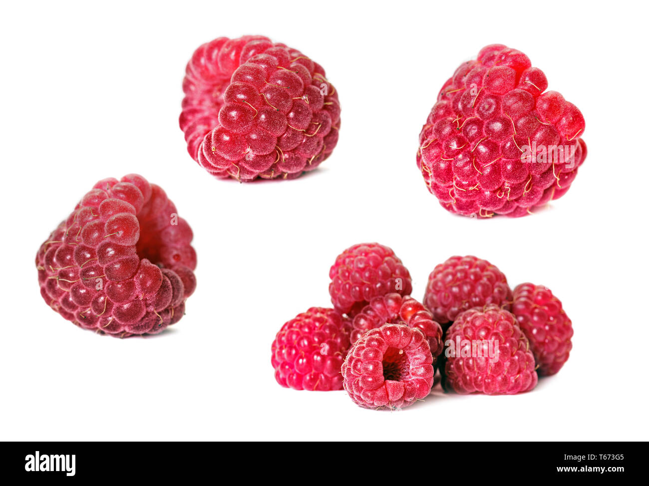 Set di lampone maturo berry isingle e gruppo isolato su bianco Foto Stock