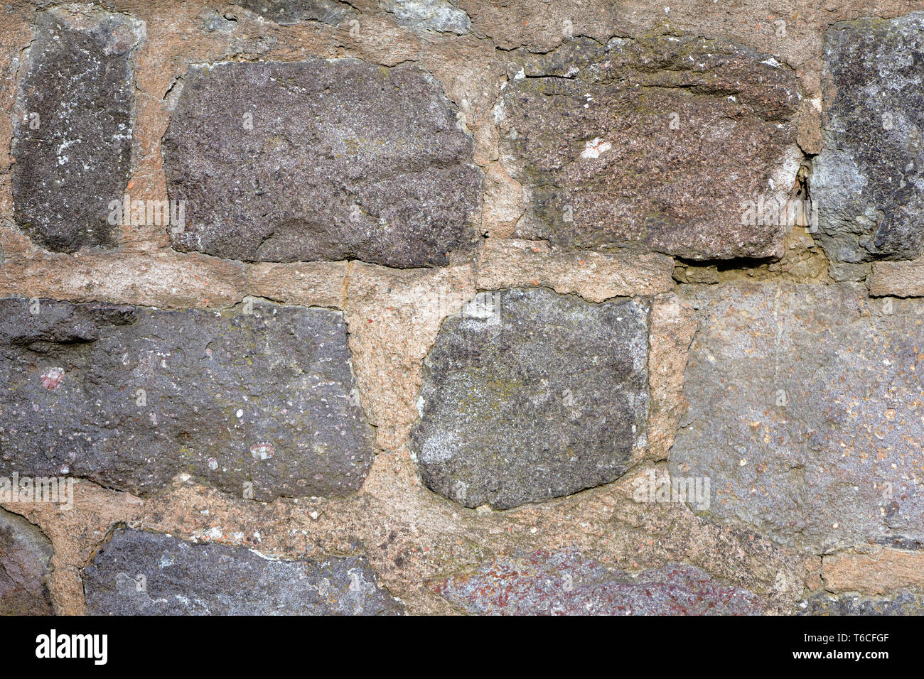 Il vecchio muro di pietra naturale Foto Stock