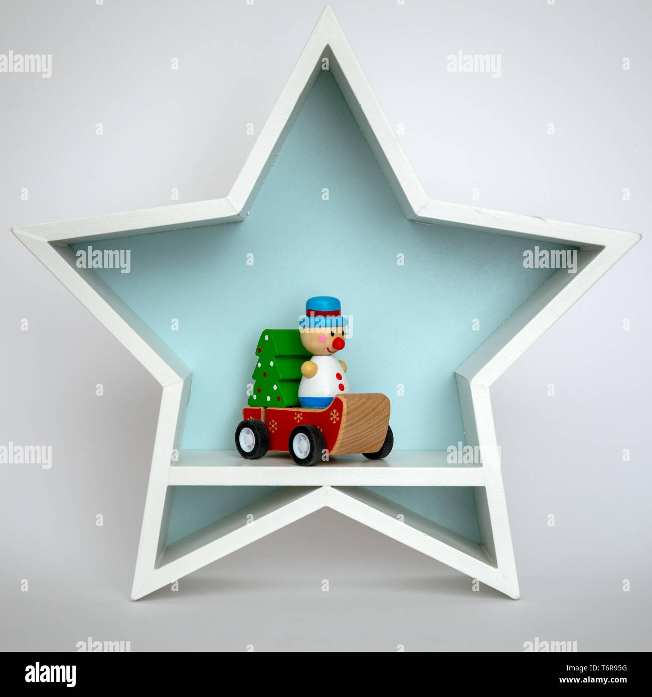 Decorazione di Natale stella bianca con divertenti figura all'interno Foto Stock