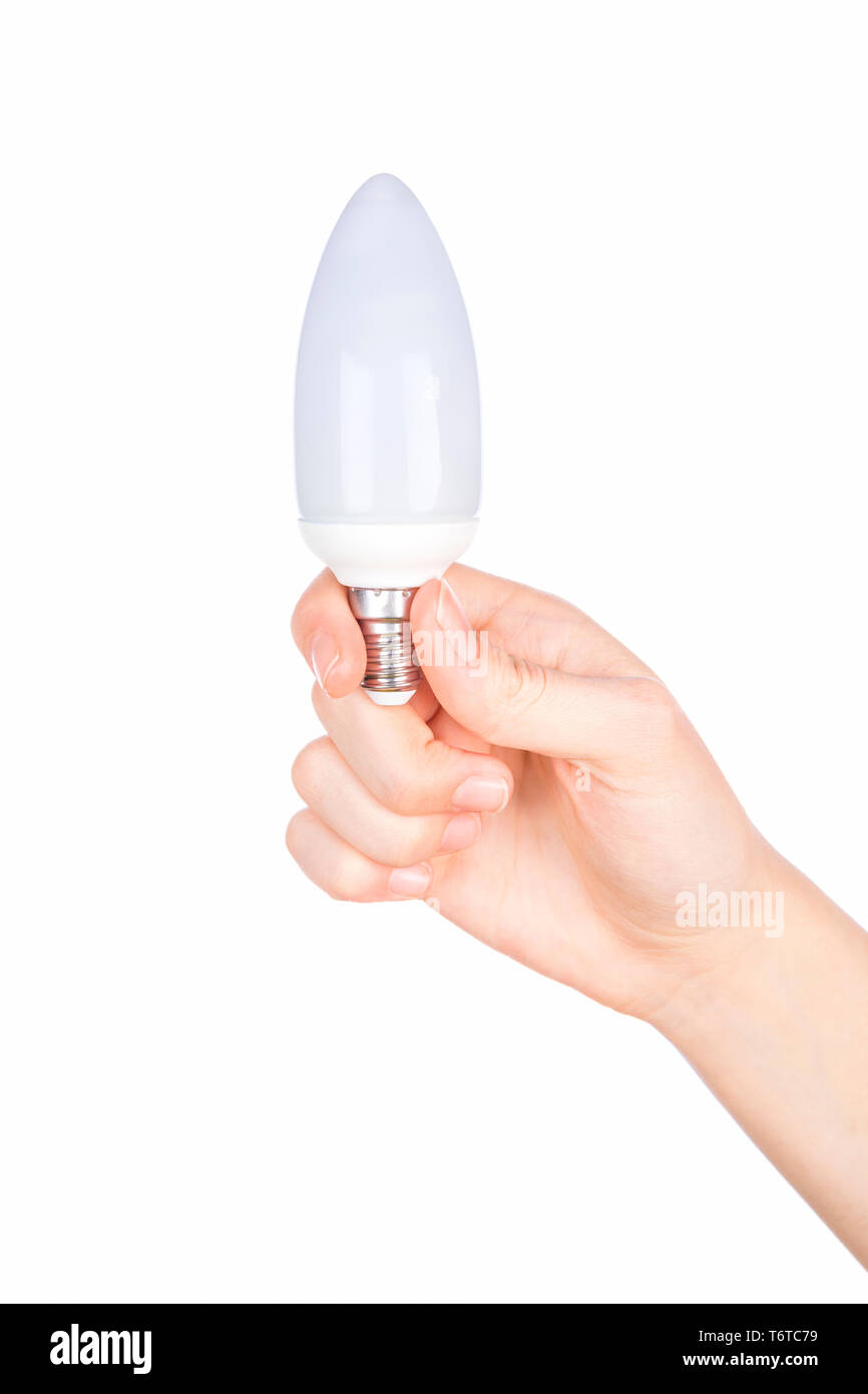 Femmina di mano che tiene una lampadina su sfondo bianco Foto Stock