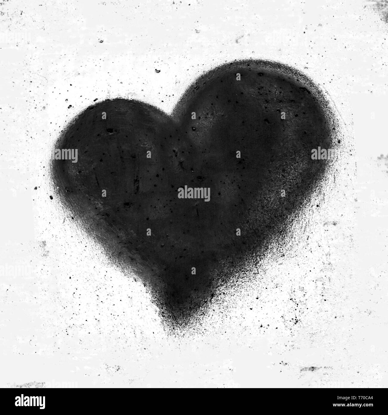 Cuore nero sulla parete di cemento Foto Stock
