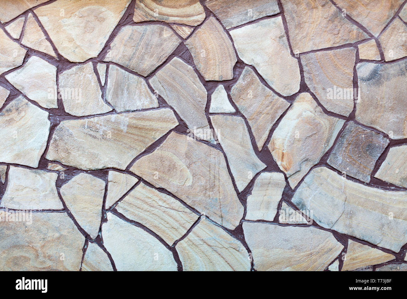 Blocco di pietra naturale texture di pavimentazione di close-up. Costruzione di sfondo. Foto Stock