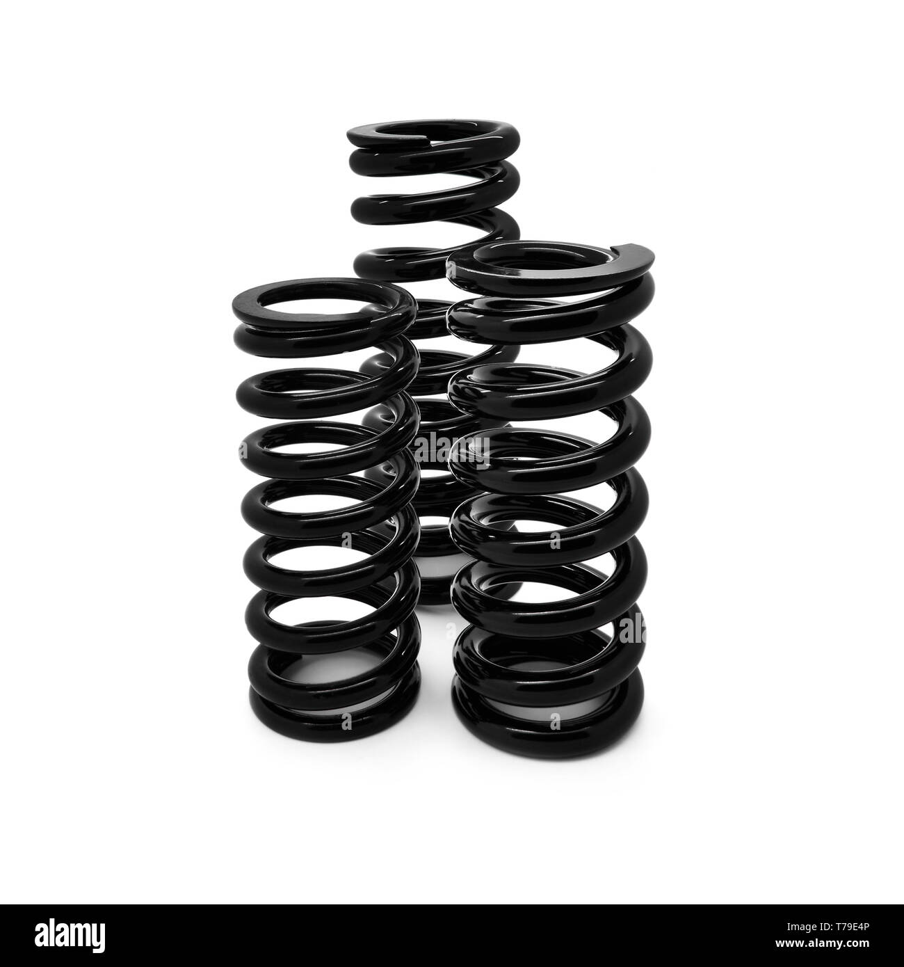 Tre differenti dimensioni delle molle a spirale su uno sfondo bianco. Foto Stock