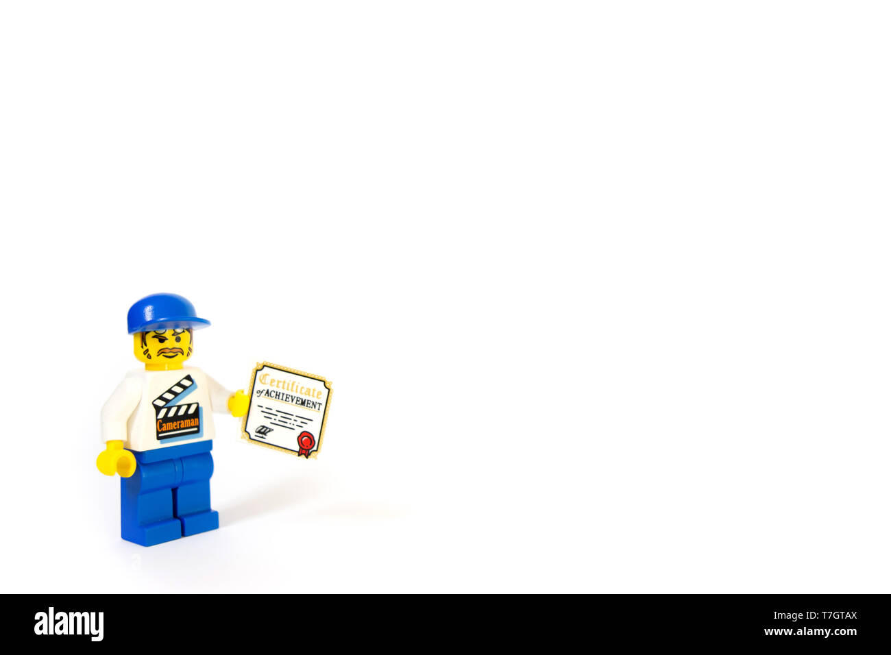 Un LEGO film maker in possesso di un certificato di conseguimento, questo cameraman progredire la sua carriera. Foto Stock