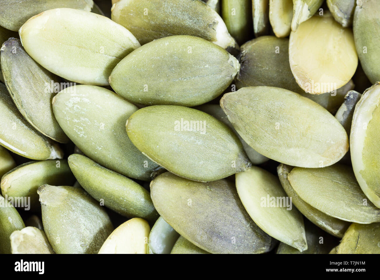 Macro close up pepitas fresco semi di zucca. Foto Stock