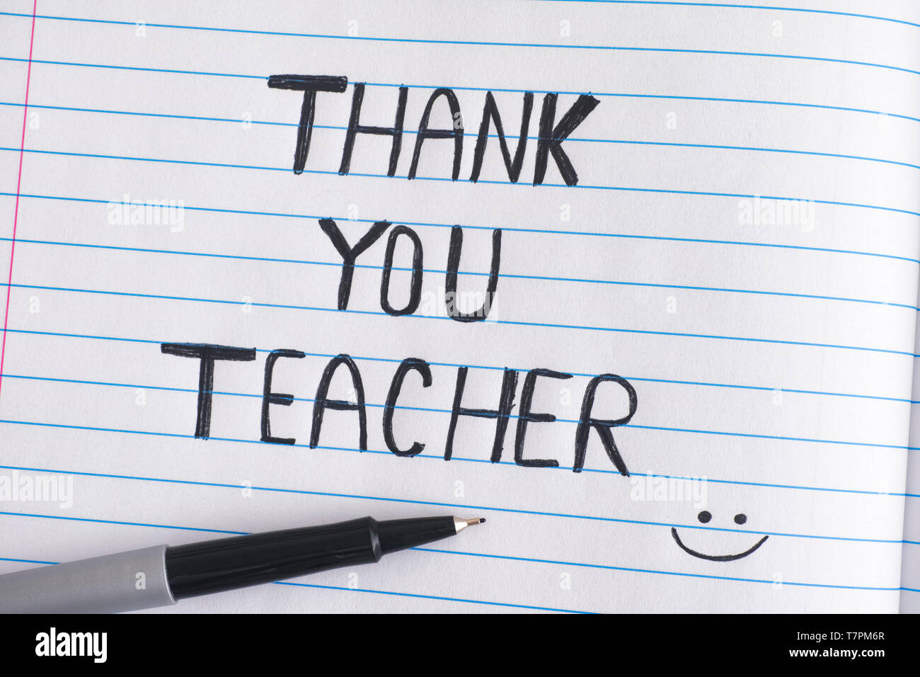 Ringrazio insegnante. Carta rigata notepad con parole Grazie insegnante. Close up. Foto Stock