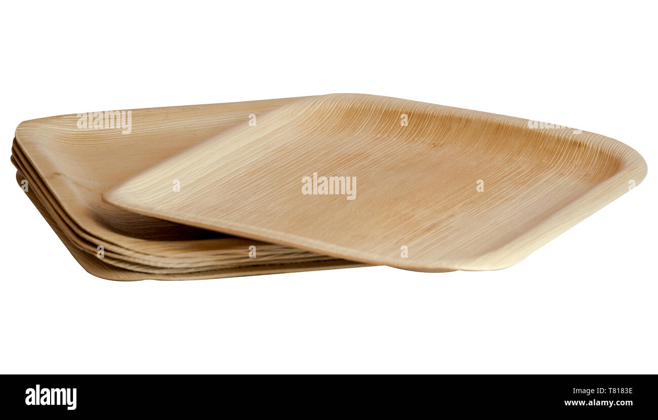 Monouso, compostabile, eco friendly, ambiente amichevole in legno in foglia di palma piastre su sfondo bianco Foto Stock