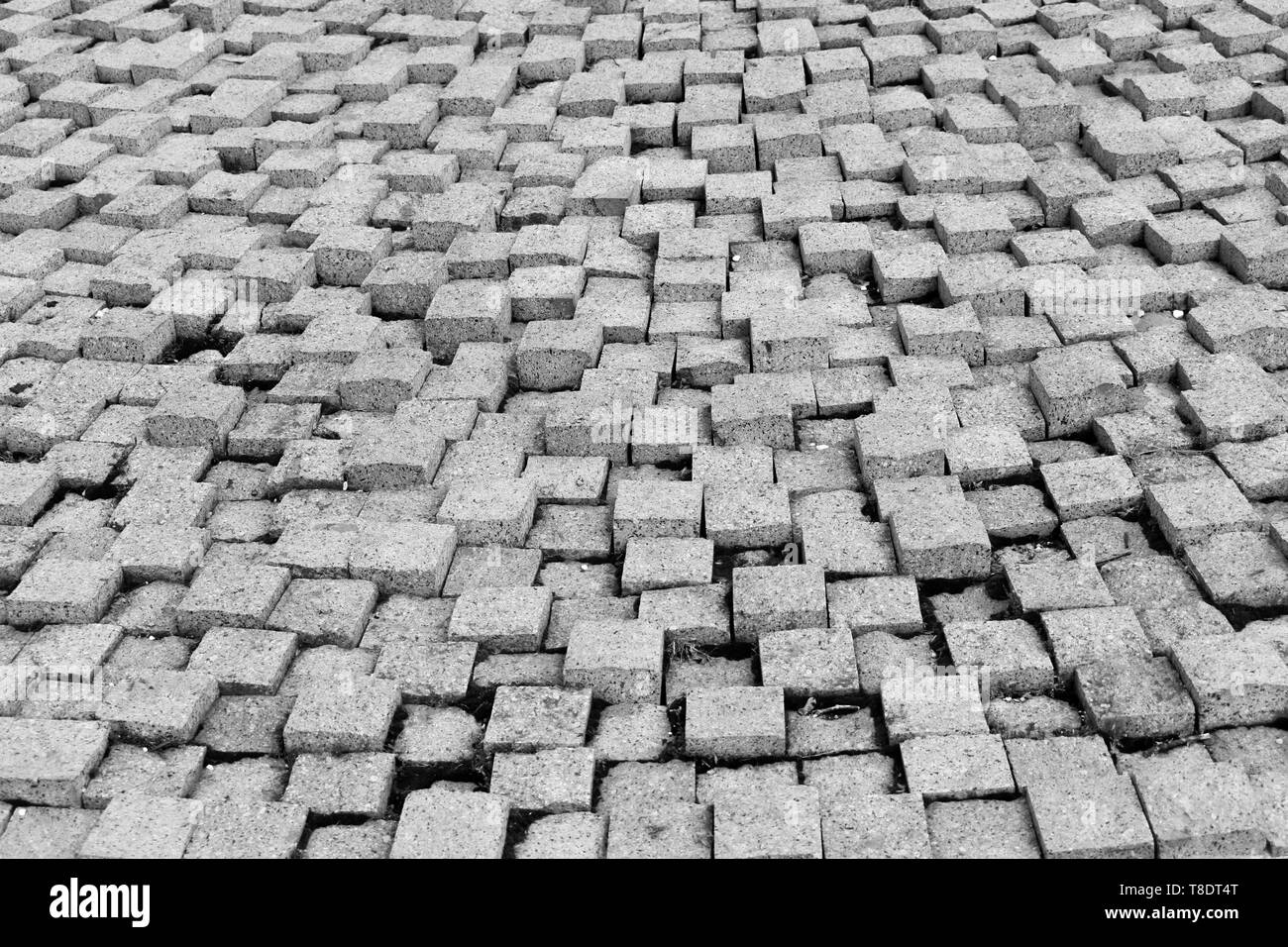 Pavimentazione in pietra texture. Il granito di ciottoli lapidato marciapiede di sfondo. Sfondo astratto di vecchi cobblestone pavement close-up Foto Stock