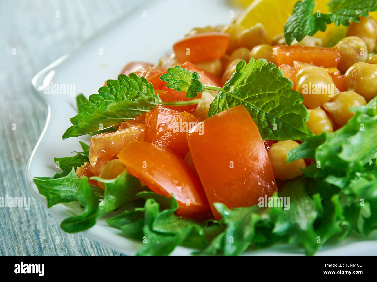 Pancetta di ceci insalata con vinaigrette Cran-Orange Foto Stock