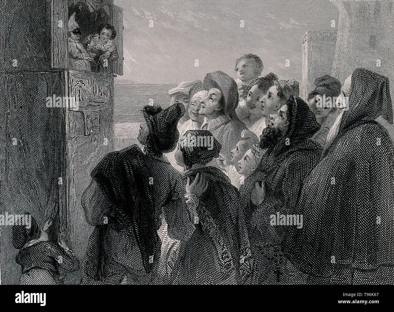 Una folla di persone raccolte intorno a un cavalletto in strada per guardare un punzone e Judy mostra a Napoli, Italia. Incisione di J. Goodyear dopo T. Uwins, 1834. Foto Stock