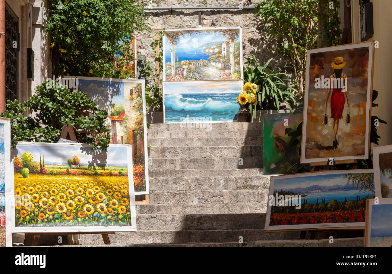 Dipinti in mostra in Corso Umberto, Taormina, Sicilia. Foto Stock