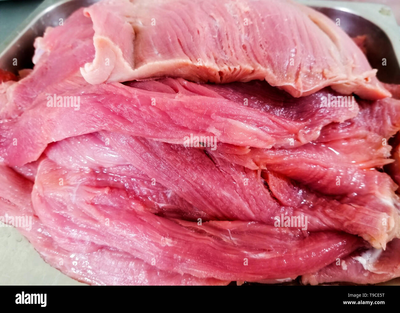 Diversi bistecca di carne di maiale uno sopra l'altro Foto Stock