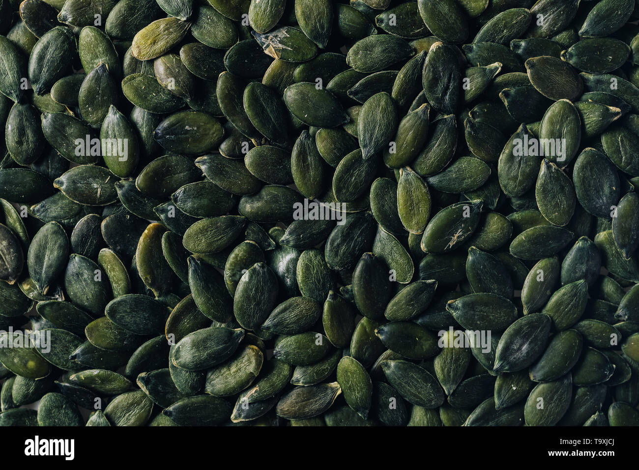 Materie semi di zucca vista superiore come sfondo di cibo Foto Stock