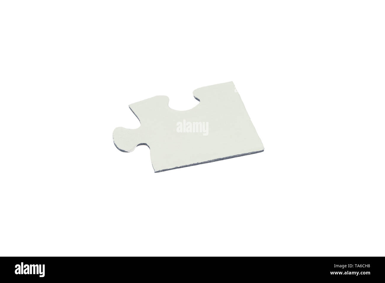 Pezzo di puzzle su sfondo bianco Foto Stock
