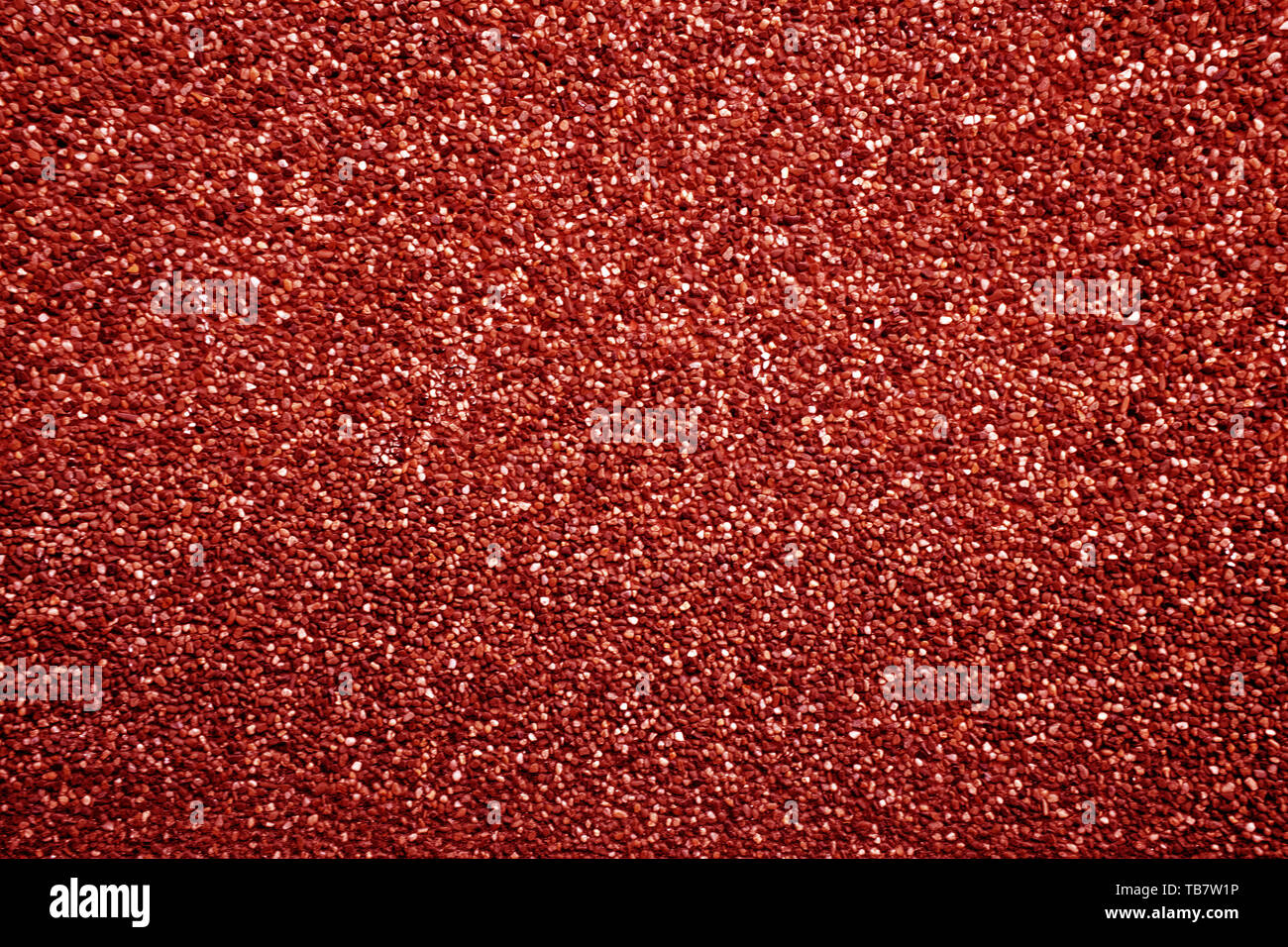 Piccolo rosso papavero ciottoli creare pattern di Nizza, ghiaia texture. Foto Stock