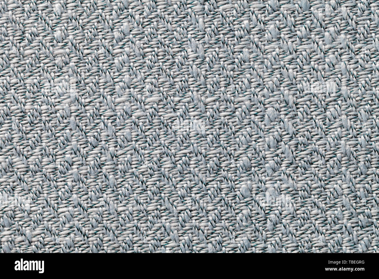 Grigio tessuto vintage con tessuto texture closeup. Macro di tessili di sfondo. Argento scuro sullo sfondo di lana. Foto Stock