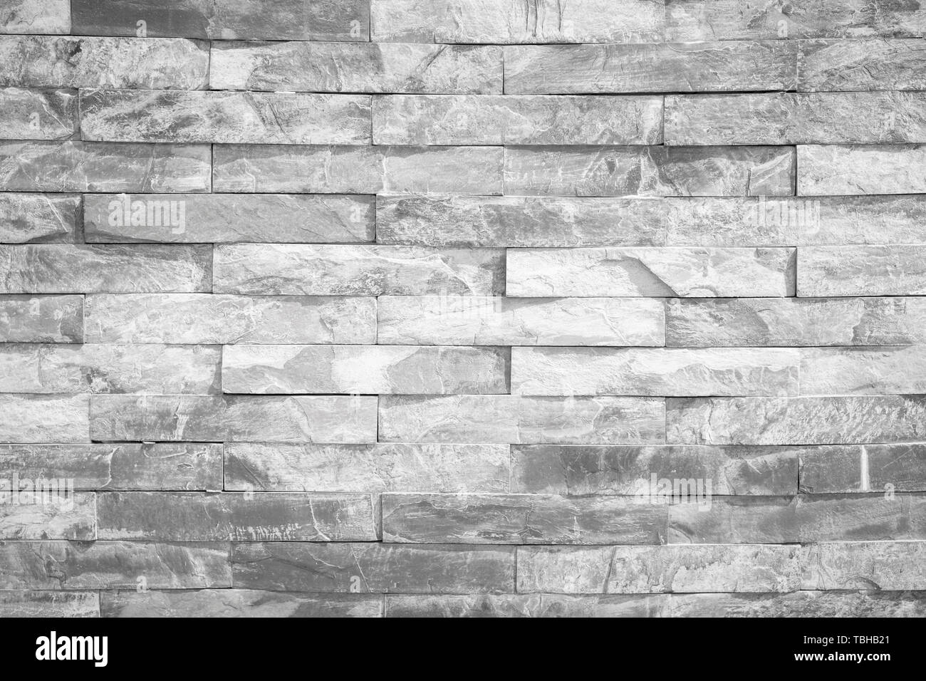 Muro di mattoni , texture di variopinte di blocchi di pietra closeup Foto Stock