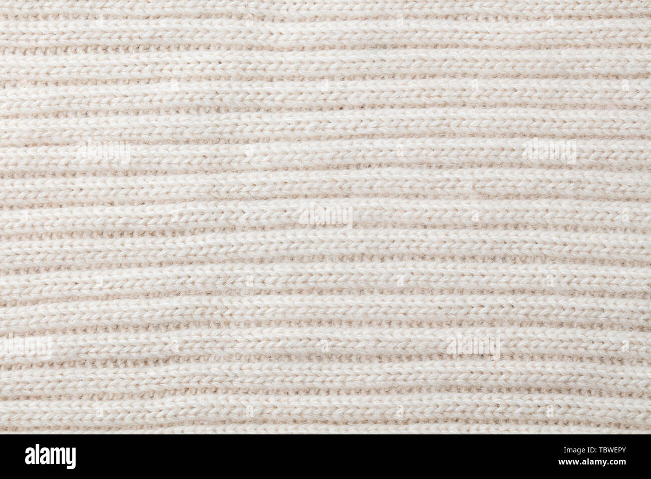 Bianco, Beige maglia di lana sfondo texture pattern con alta risoluzione. Vista dall'alto. Copia dello spazio. Foto Stock