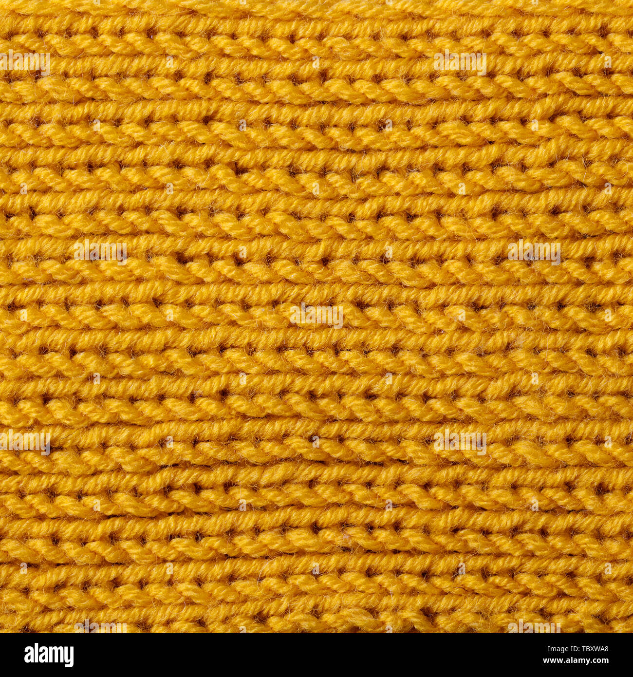 Giallo maglia di lana sfondo texture pattern con alta risoluzione. Vista dall'alto. Copia dello spazio. Foto Stock