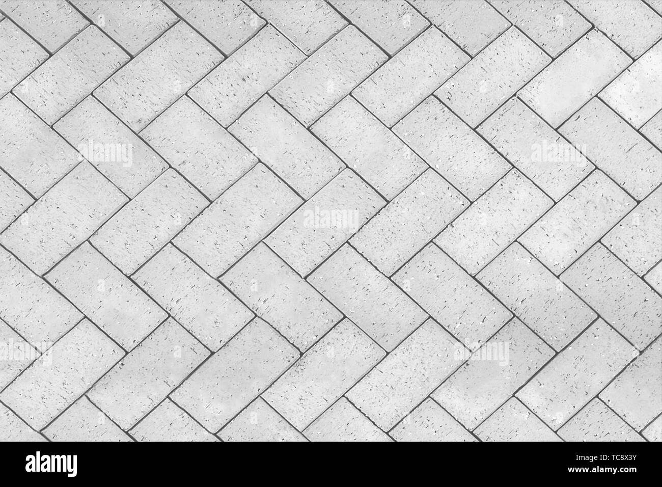 Mattoni pavimento piastrellato con andamento a zig-zag texture dello sfondo  Foto stock - Alamy