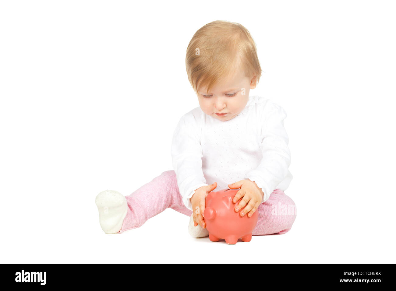 Salvadanaio con neonato bambina Scarpe e 100 euro banconota isolati su  sfondo bianco Foto stock - Alamy