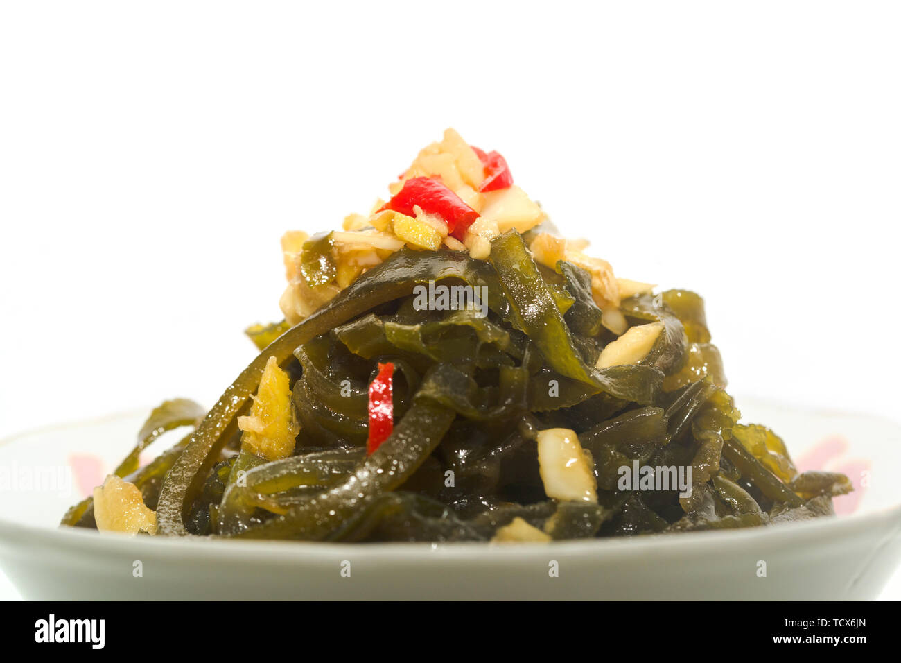Il freddo kelp seta in un colore bianco porcellana ciotola Foto Stock