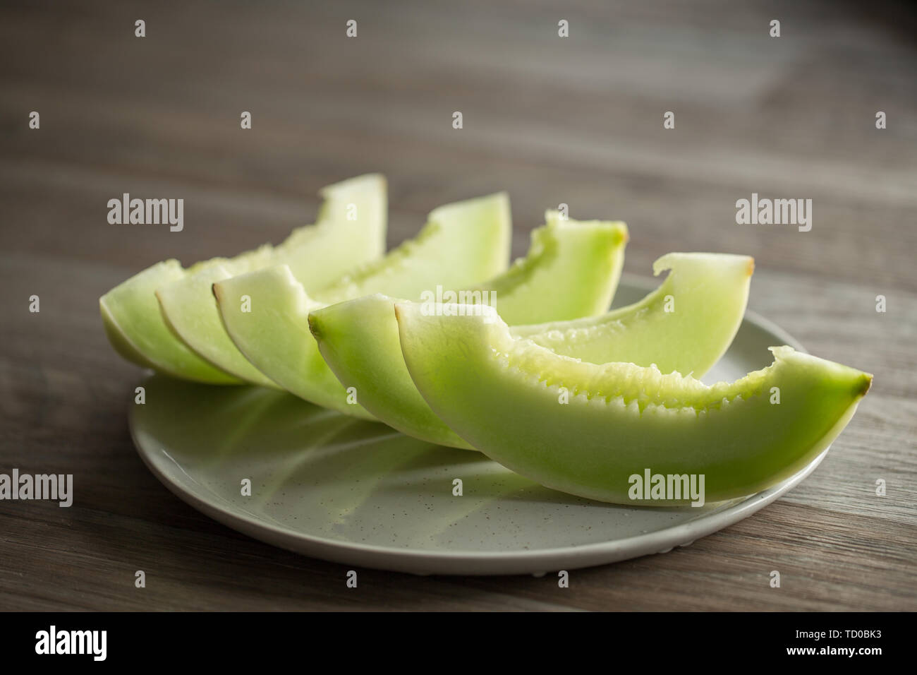 Tagliare il melone di miele Foto Stock