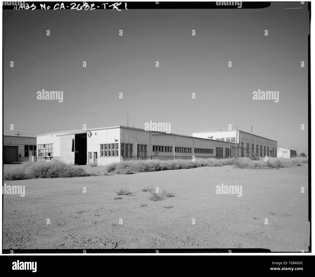 Vista obliqua; telecamera rivolta verso sud-ovest. - Alimentazione navali allegato Stockton, locomotore gru e negozio di macchina, angolo nordoccidentale di McCloy Avenue e Ellsberg Drive, Stockton, San Joaquin County, CA Foto Stock