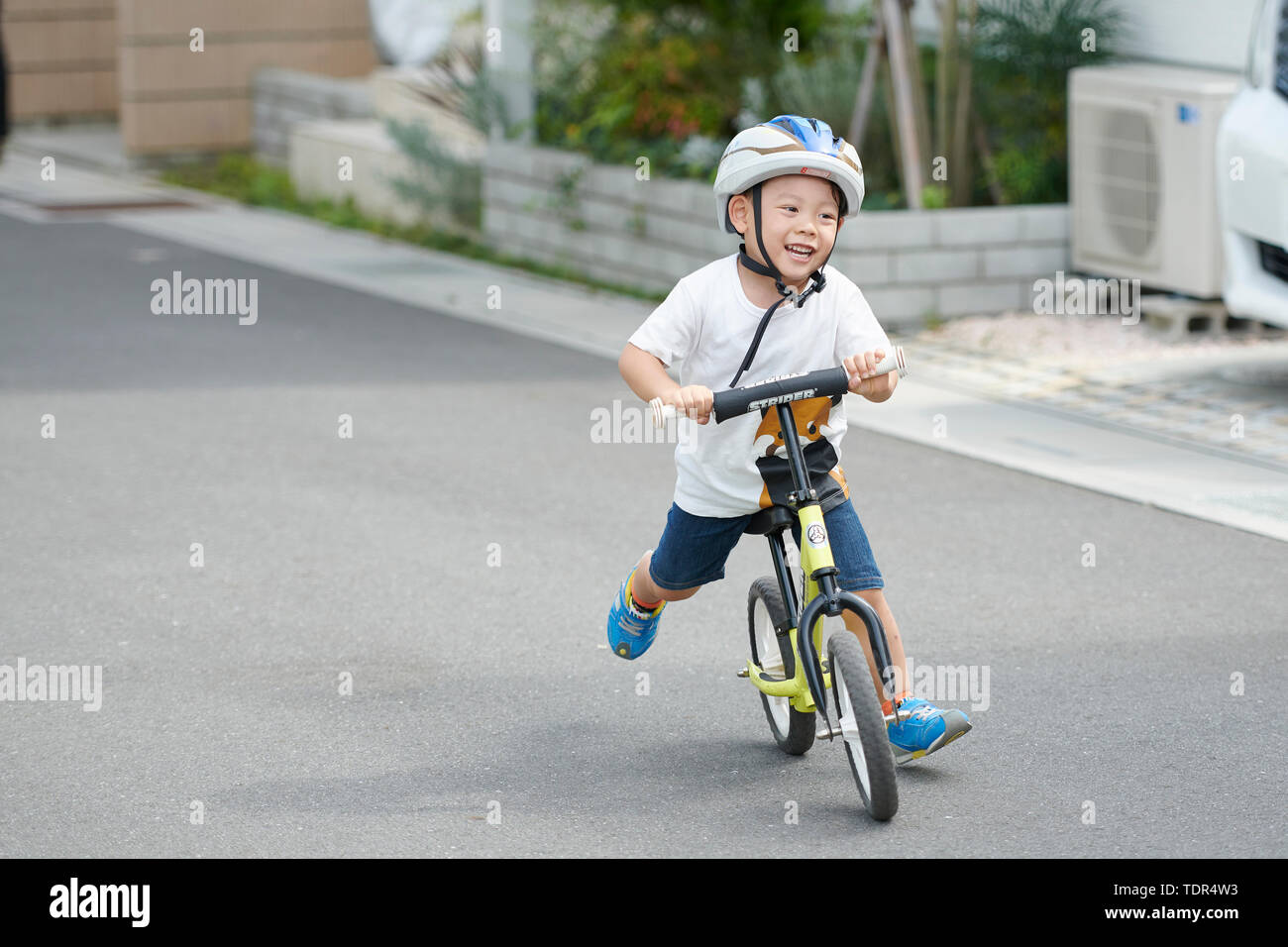 Ragazzo giapponese su una moto Foto Stock