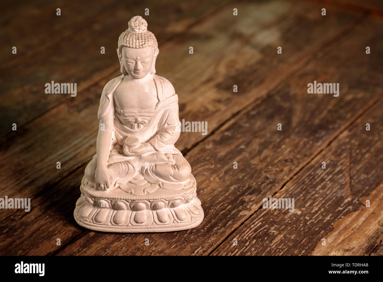 Figurina bianca del buddha di fossili di Foto Stock