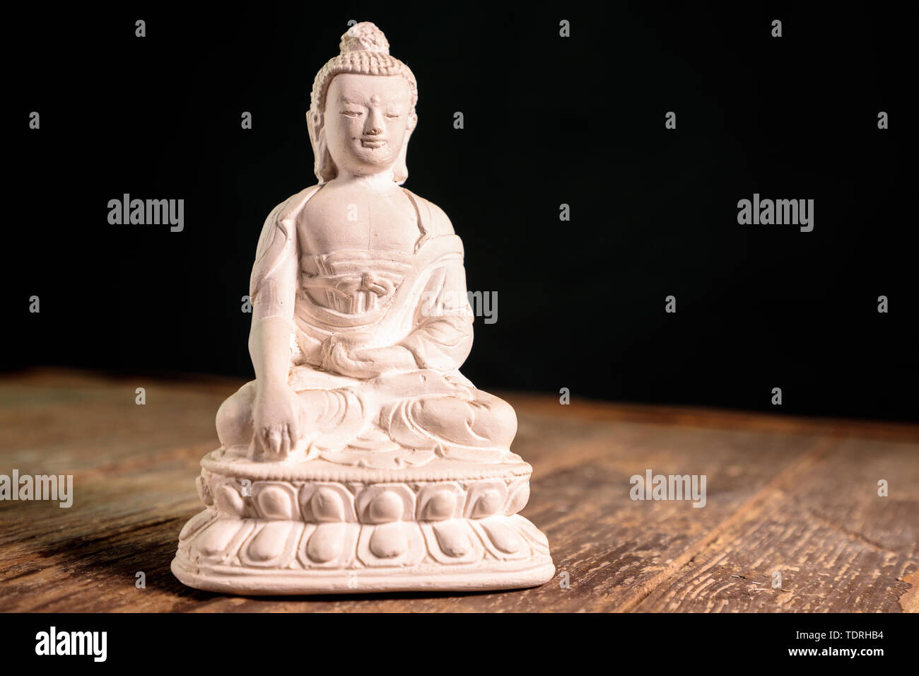Figurina bianca del buddha di fossili di Foto Stock